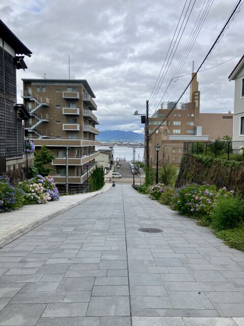 The paved slope of Hachiman-zaka in Motomachi, Hakodate, running straight down to the harbour
