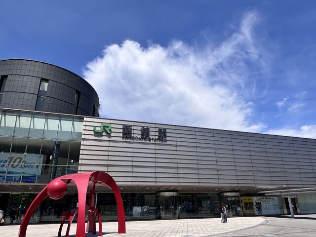 The front of JR Hakodate Station under a bright sky