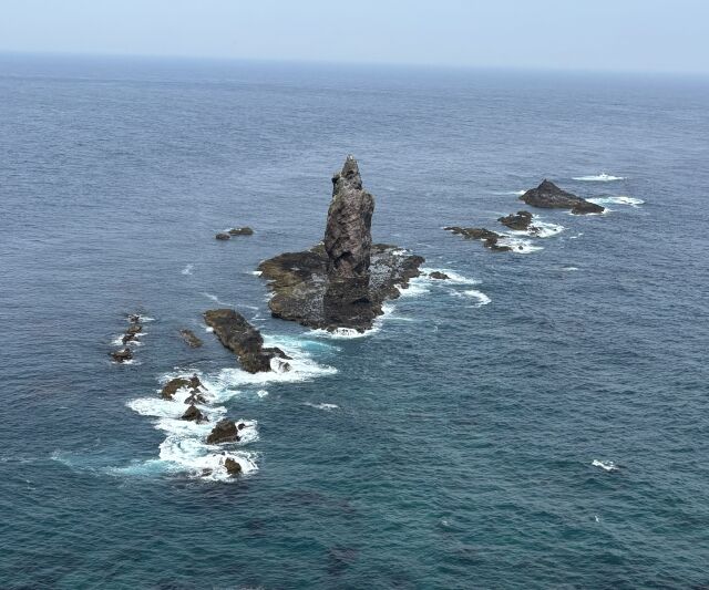 Sea stacks and submerged reefs off Cape Kamui seen from above in flat light